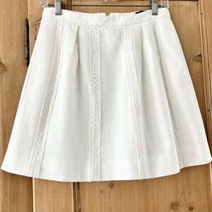 J. Crew white lace inset pleated mini skirt